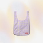 Purple grid-patterned bag with 'OH ME!' text on a gradient background